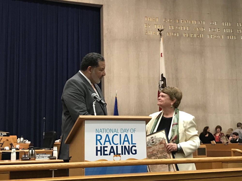The Reverend Alvin Herring of the W.K. Kellogg Foundation receives a proclamation from Los Angeles County Supervisor Sheila Kuehl.